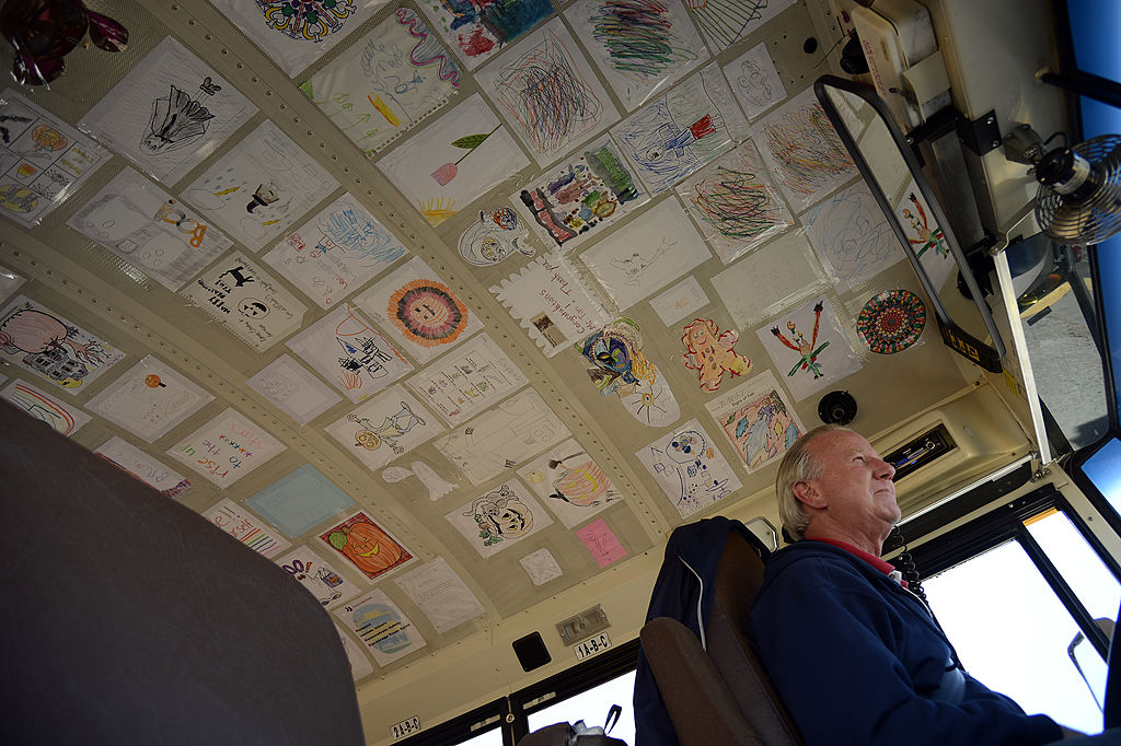 pictures drawn by kids on the roof of the school bus