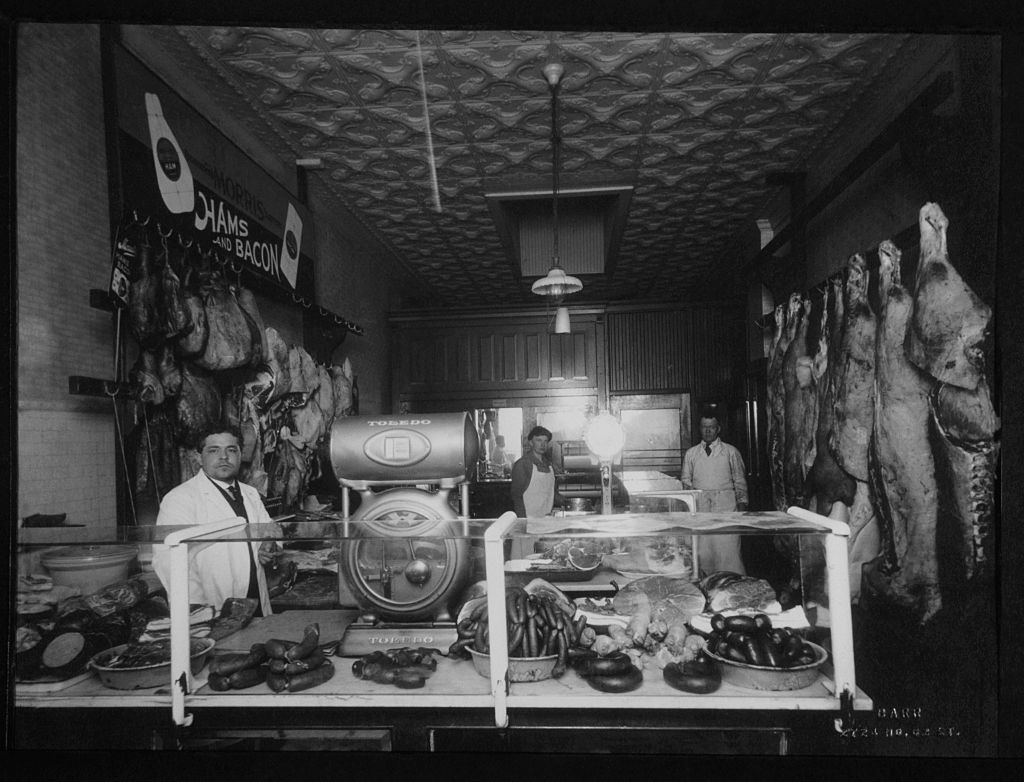 Men working in butchers shop