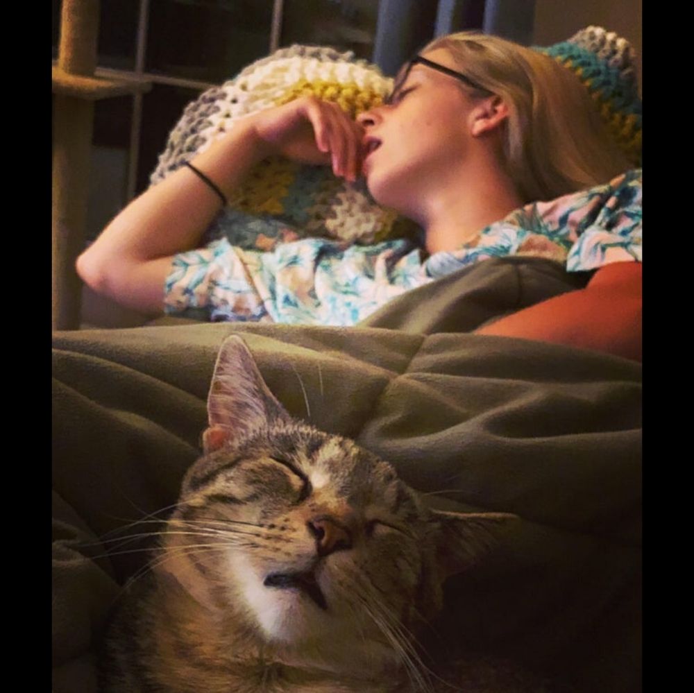 owner and cat sleeping with mouths open