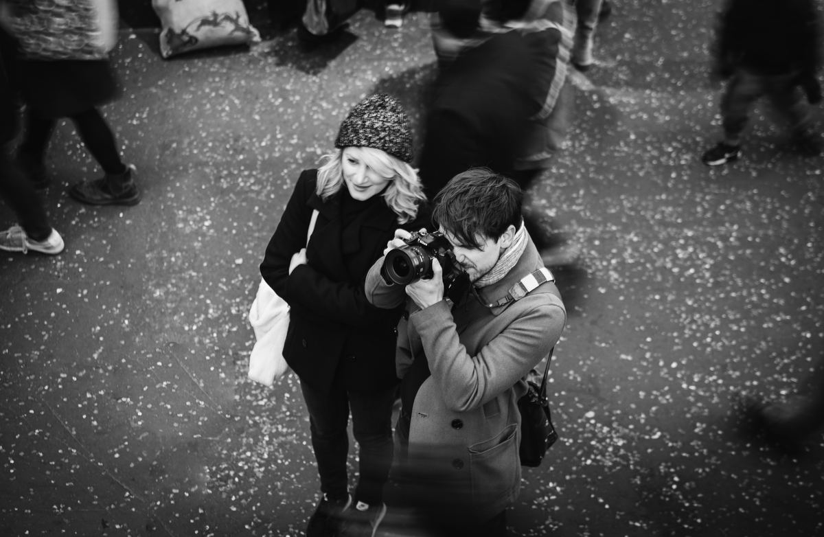 couple taking pictures black and white