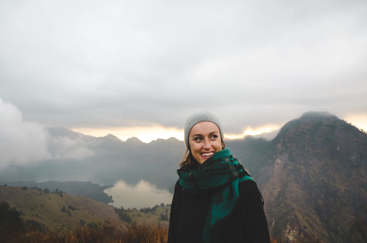 woman smiling on montaintop