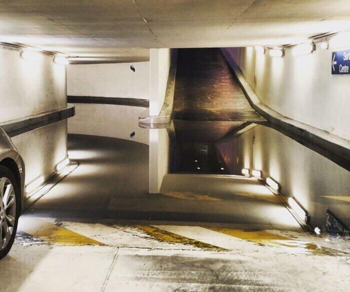 two entrances for parking garage one that's actually a puddle