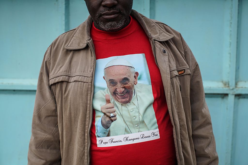man wearing religious shirt