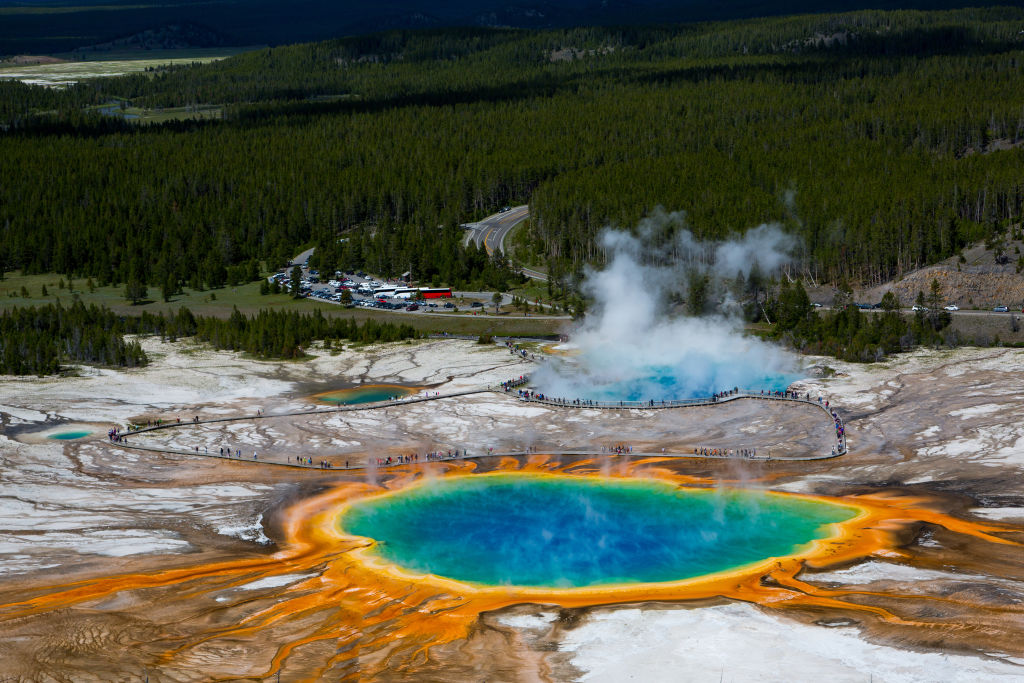 grand prismatic spring in yellowstone national park with colors of orange, yellow, green, and blue