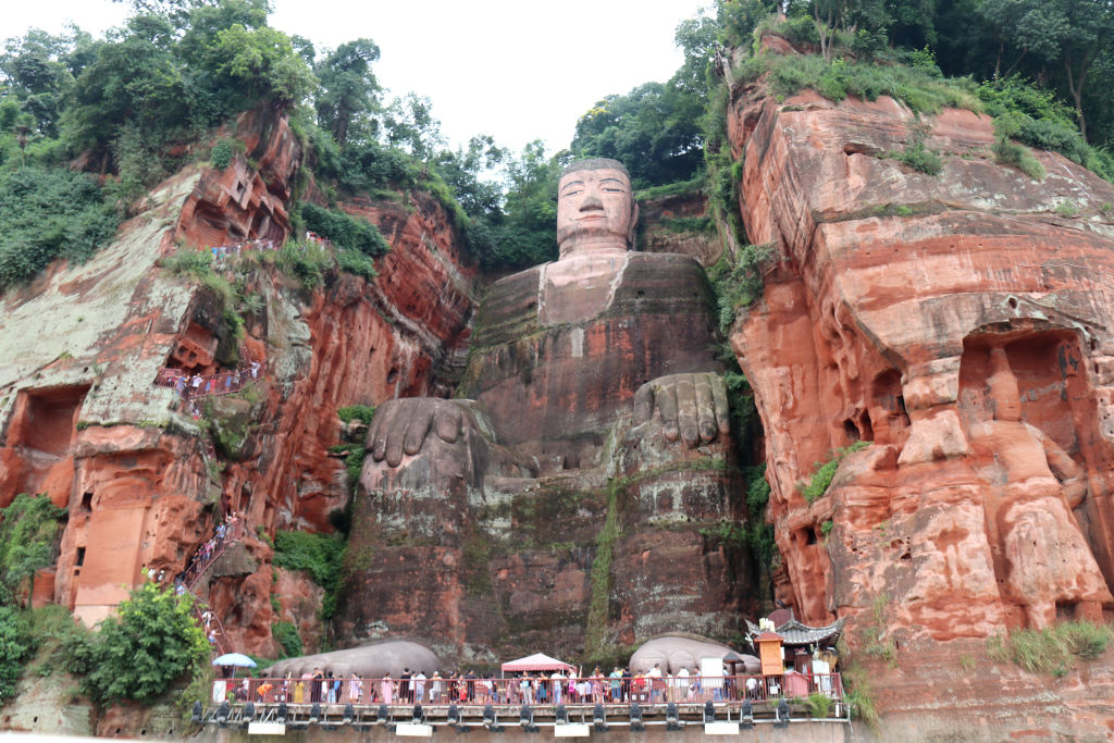 Tourists visit the Leshan Giant Buddha