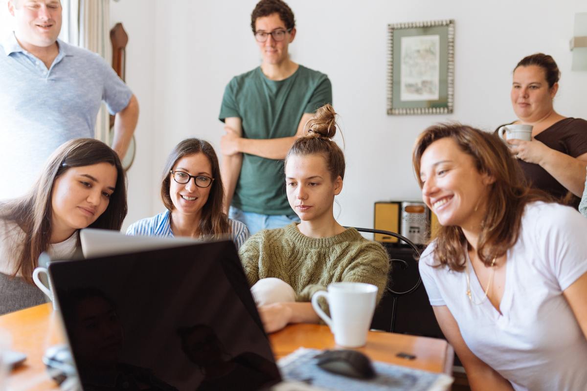 group of people looking at computer screen