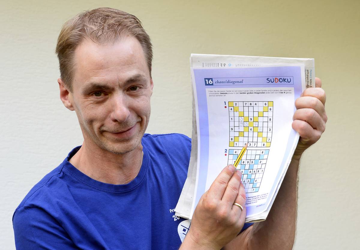 The World Champion of sudoku, Michael Ley, shows off his puzzle.
