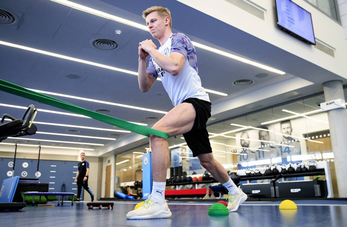 A man works out during a gym training session.