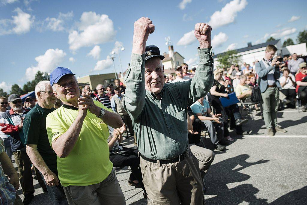 group of men at auction