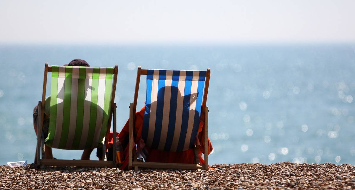 people sitting on beach chairs