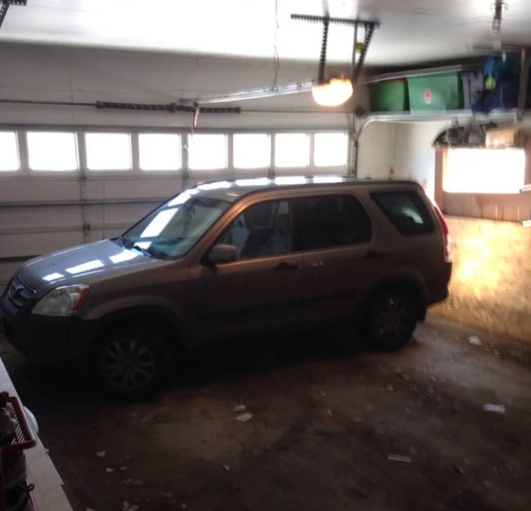 car parked inside garage parallel to the exit