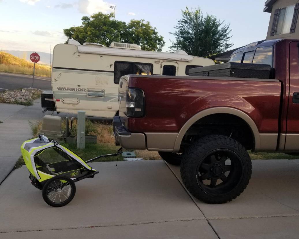 bicycle buggy extension for small child attached to a pickup truck