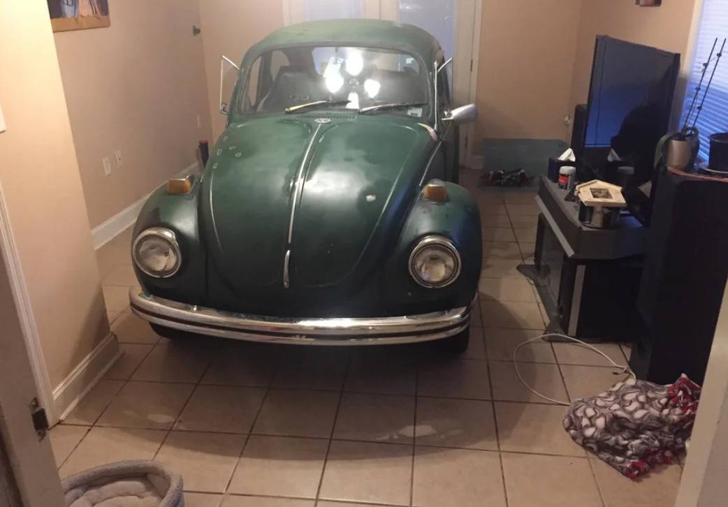 vintage VW bug parked inside house