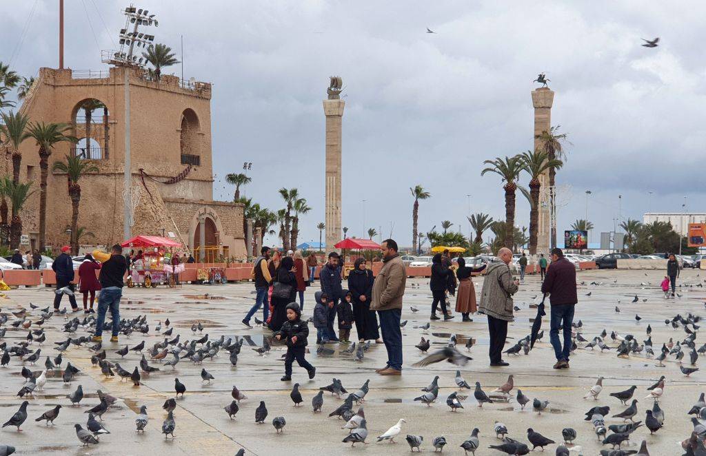 people and birds gathering in town in tripoli, libya