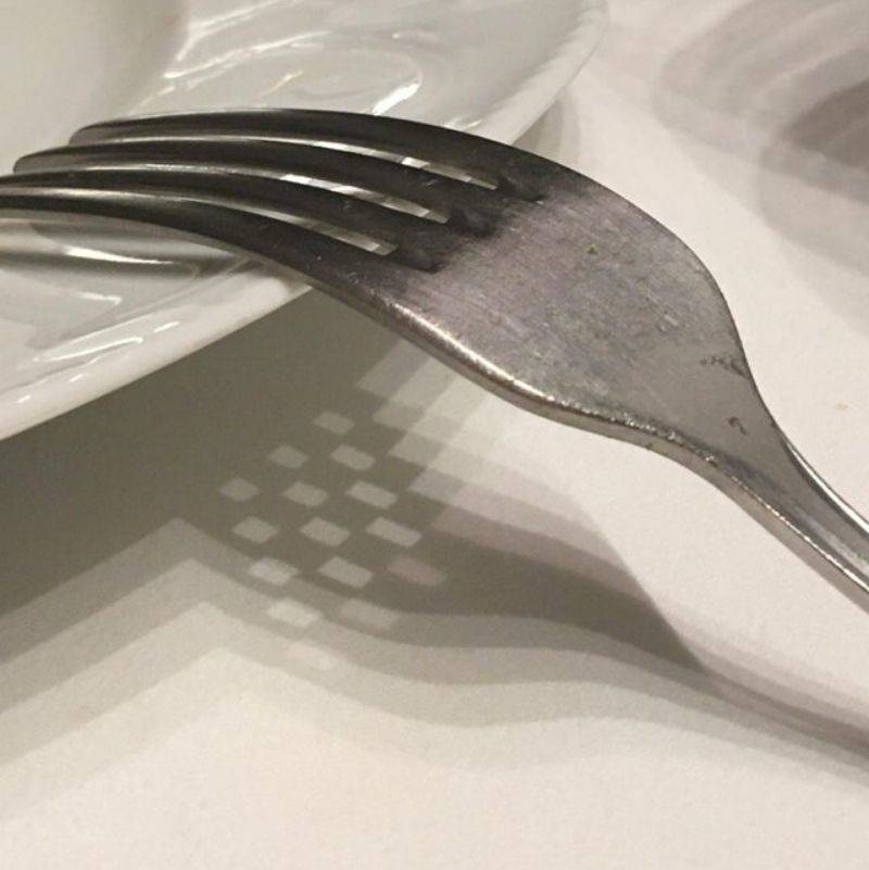a fork's shadow looks like a criss cross