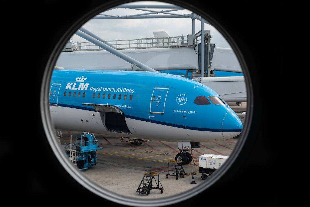  KLM Royal Dutch Airlines plane at Amsterdam Schiphol Airport runway. 