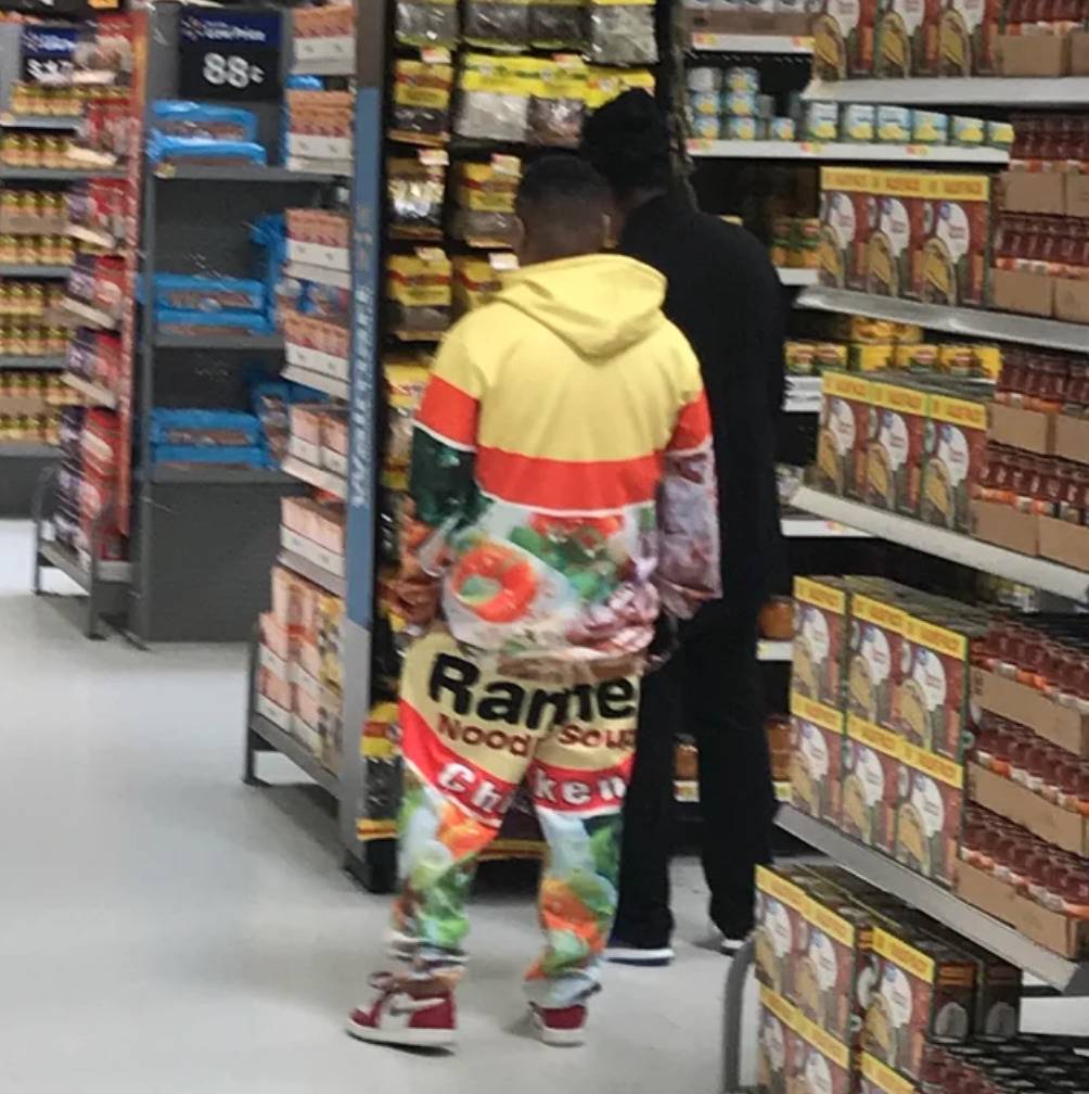 man wears sweatsuit with ramen noodle packet design