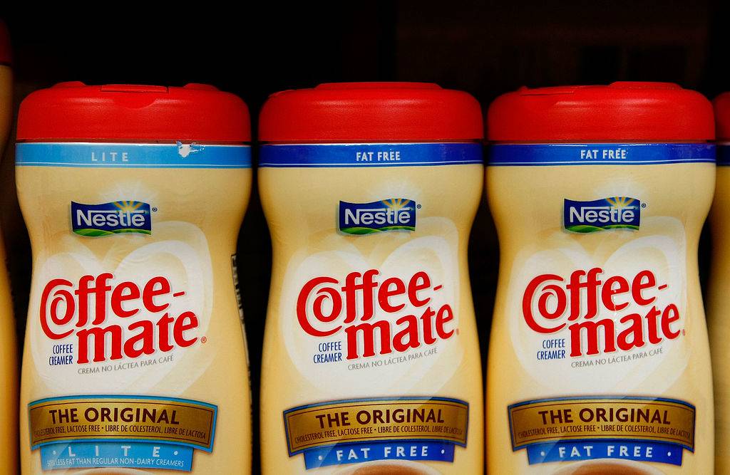 three coffee-mate coffee creamer bottles