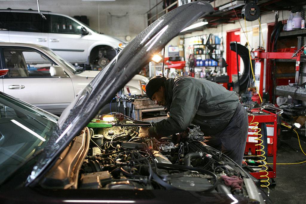 a mechanic working on a car