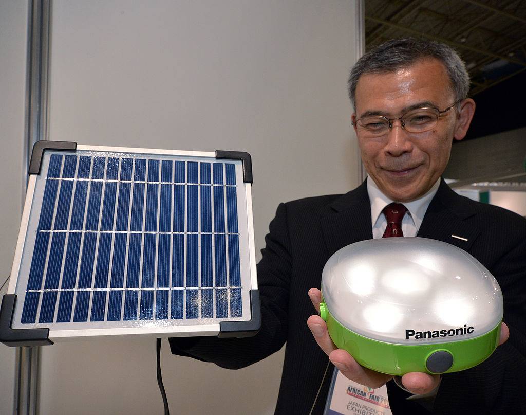 Japanese electronics giant Panasonic engineer Kiyofumi Abo displays a prototype of a solar lantern