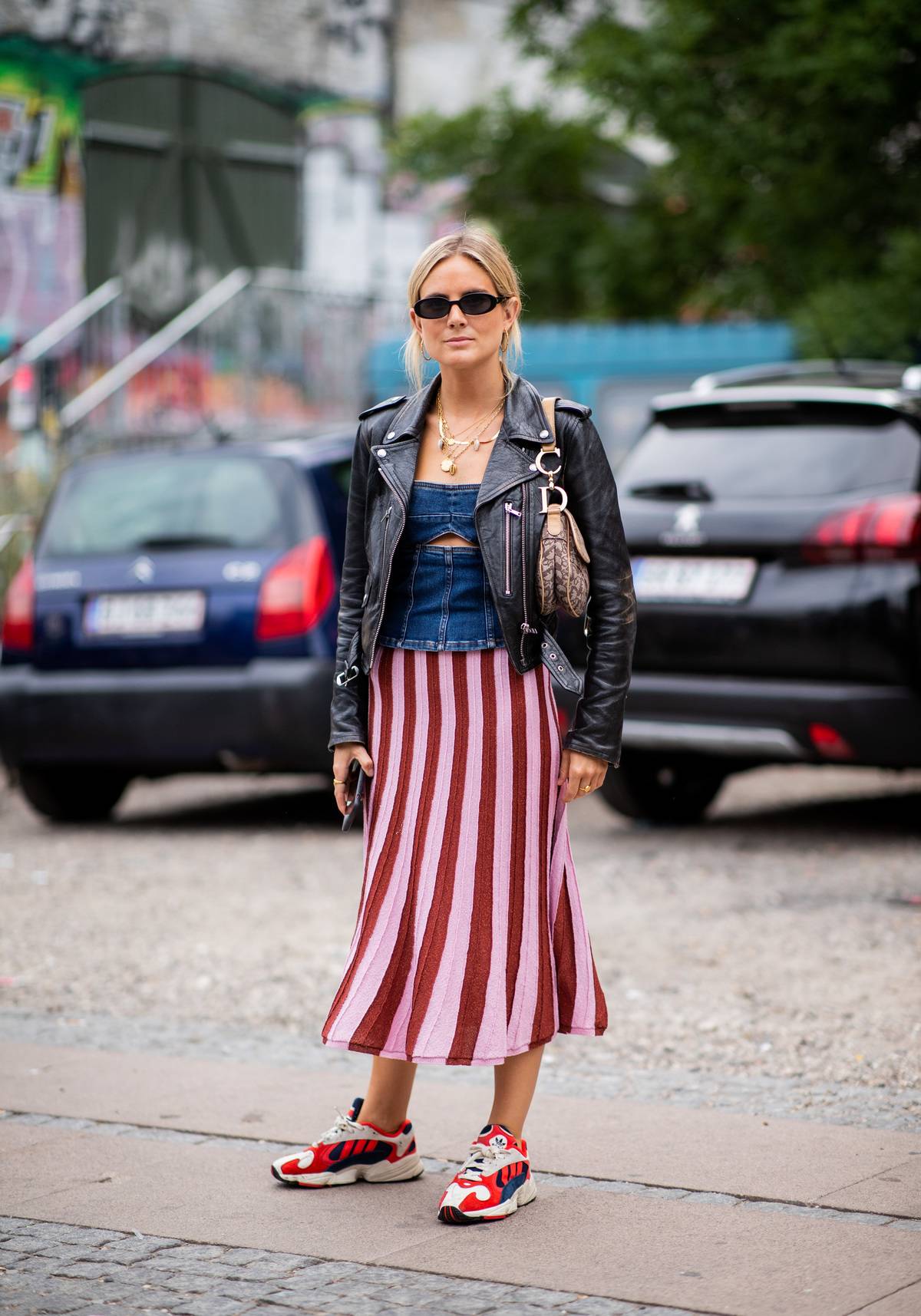 woman wears sneakers with outfit