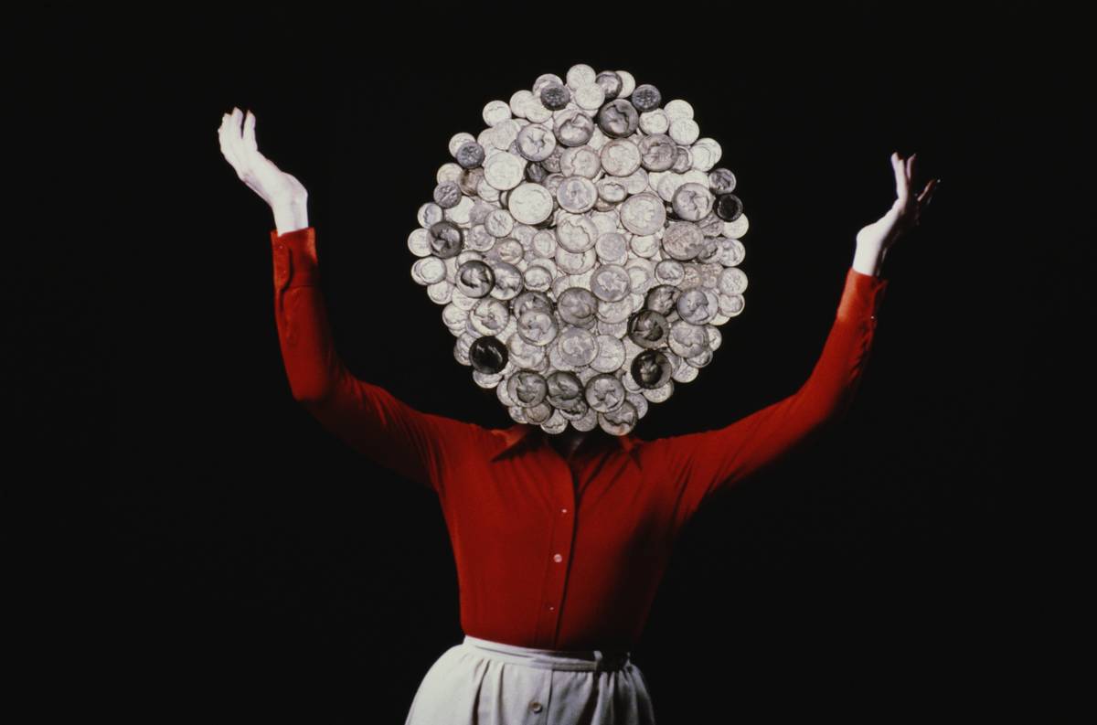 A woman with coins for a head