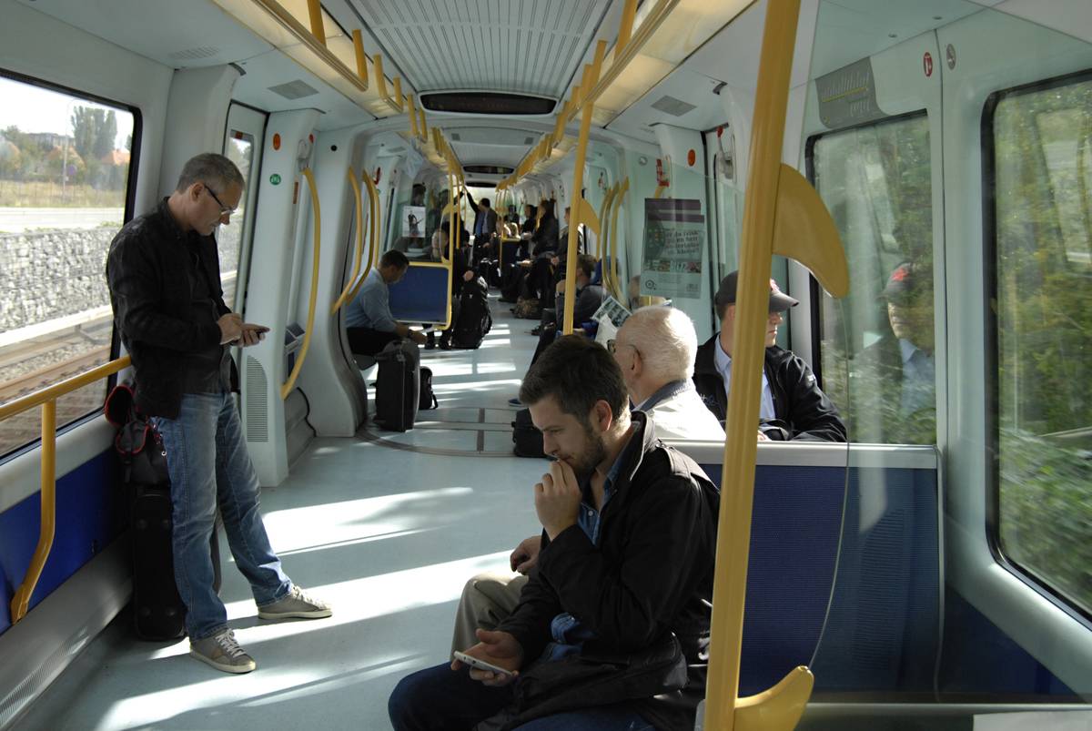 people spaced out on metro train car