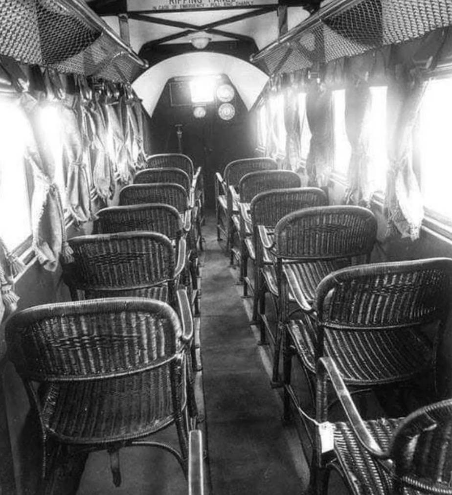 inside of a passenger plane has wicker seats