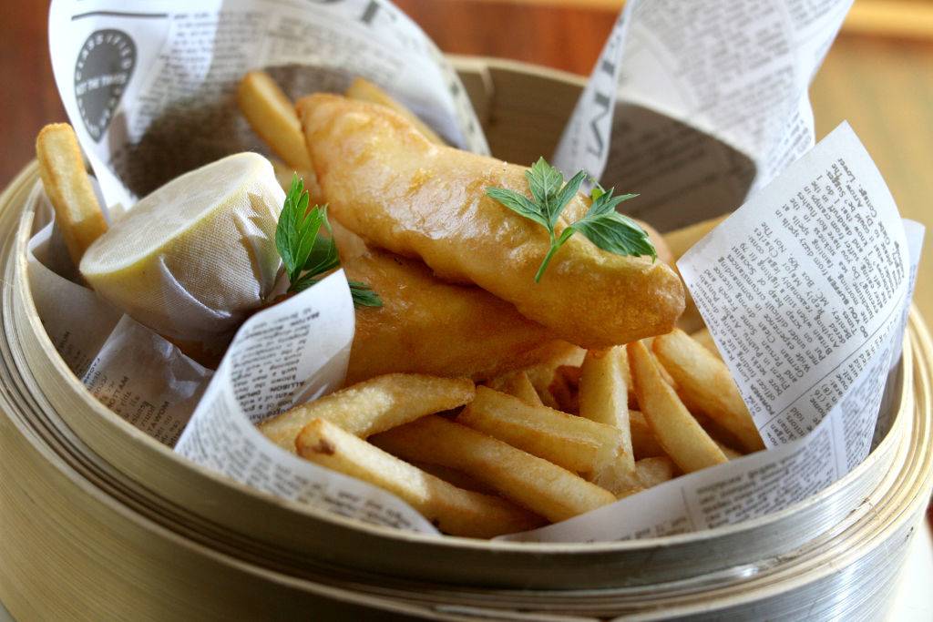 fried fish and french fries in a basket