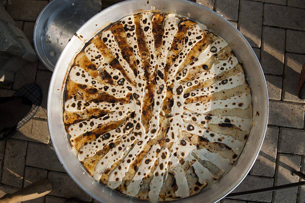 flija dough being made in a big silver pot