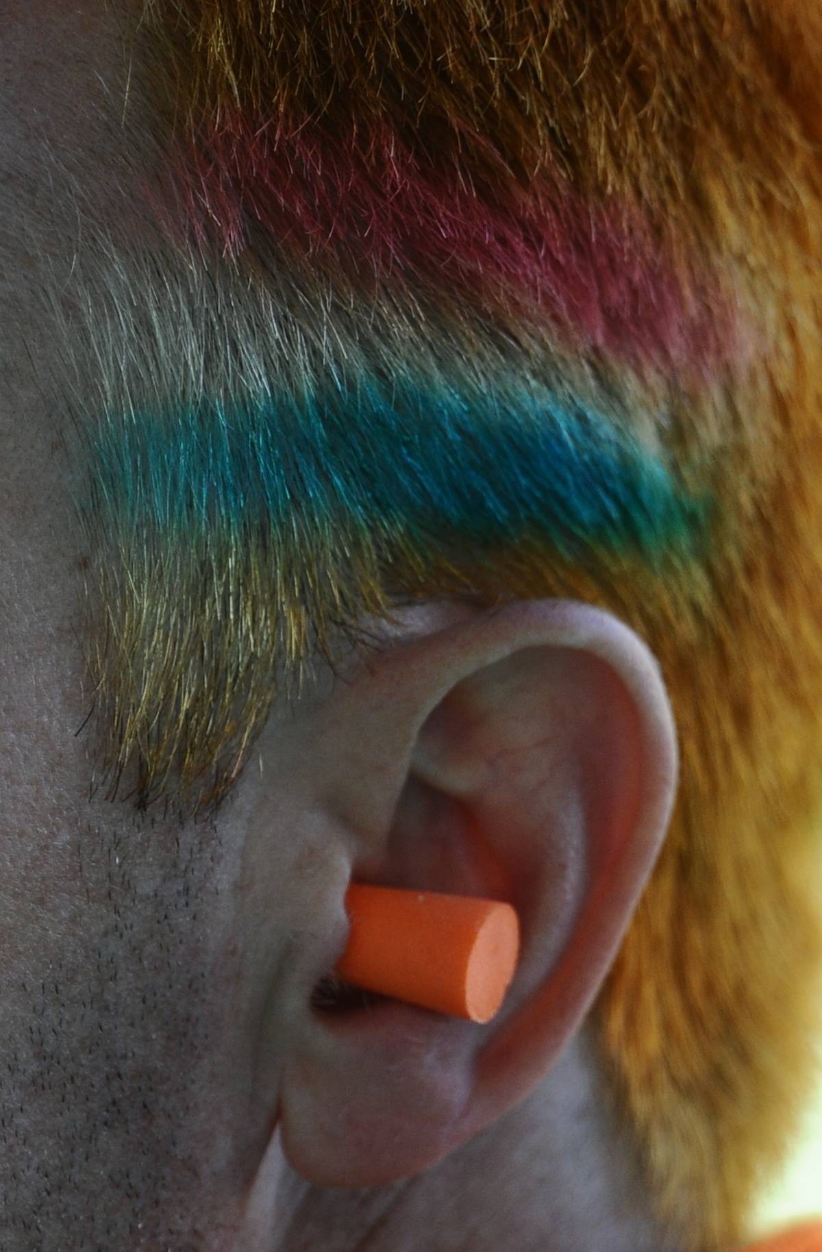 person with earplug in