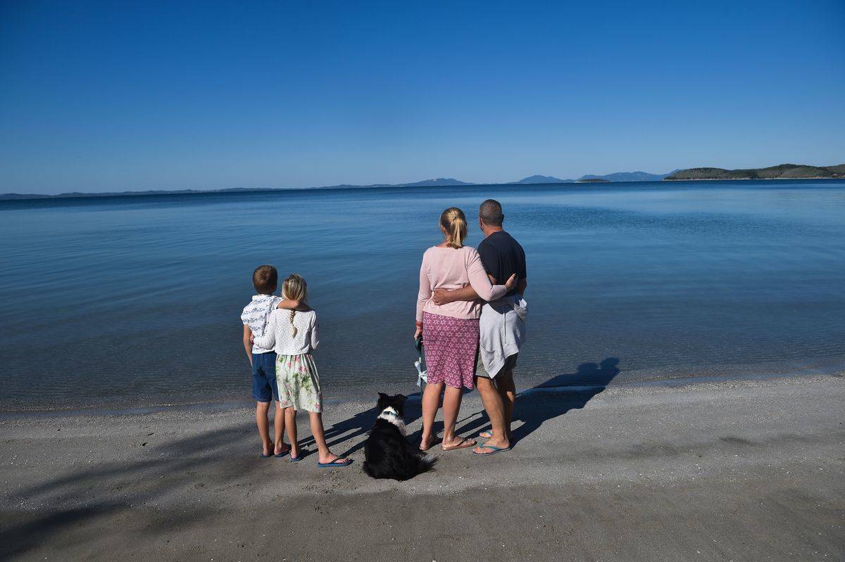 A family from England watch the sea