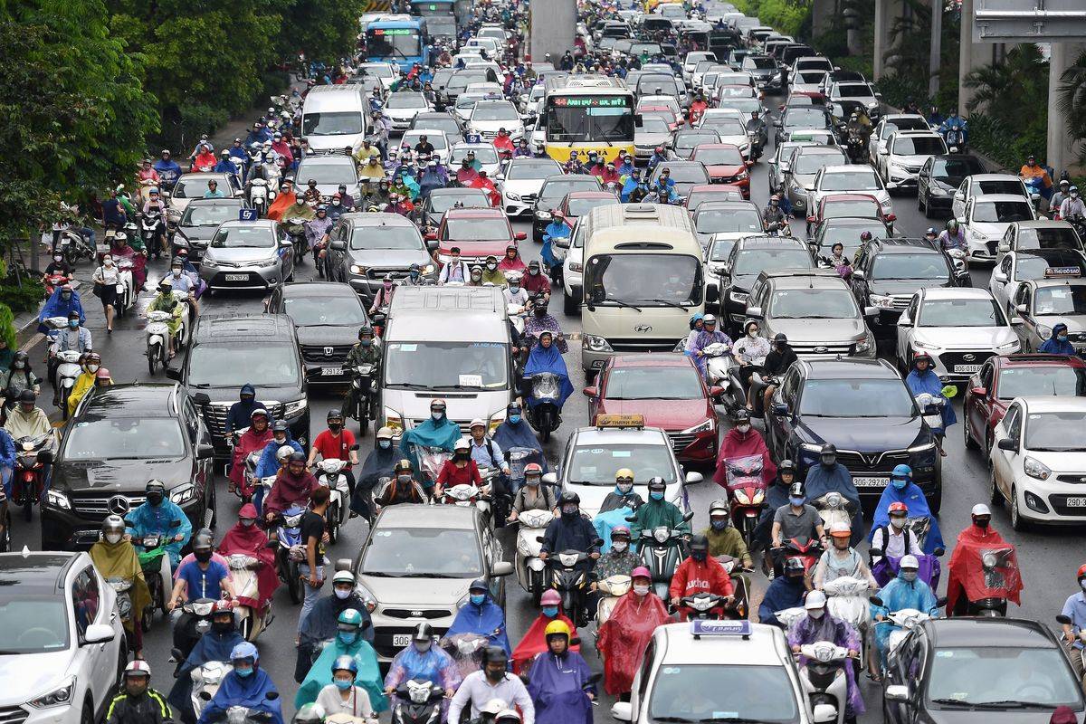 Motorists are pictured in morning rush hour traffic on a congested road in Hanoi