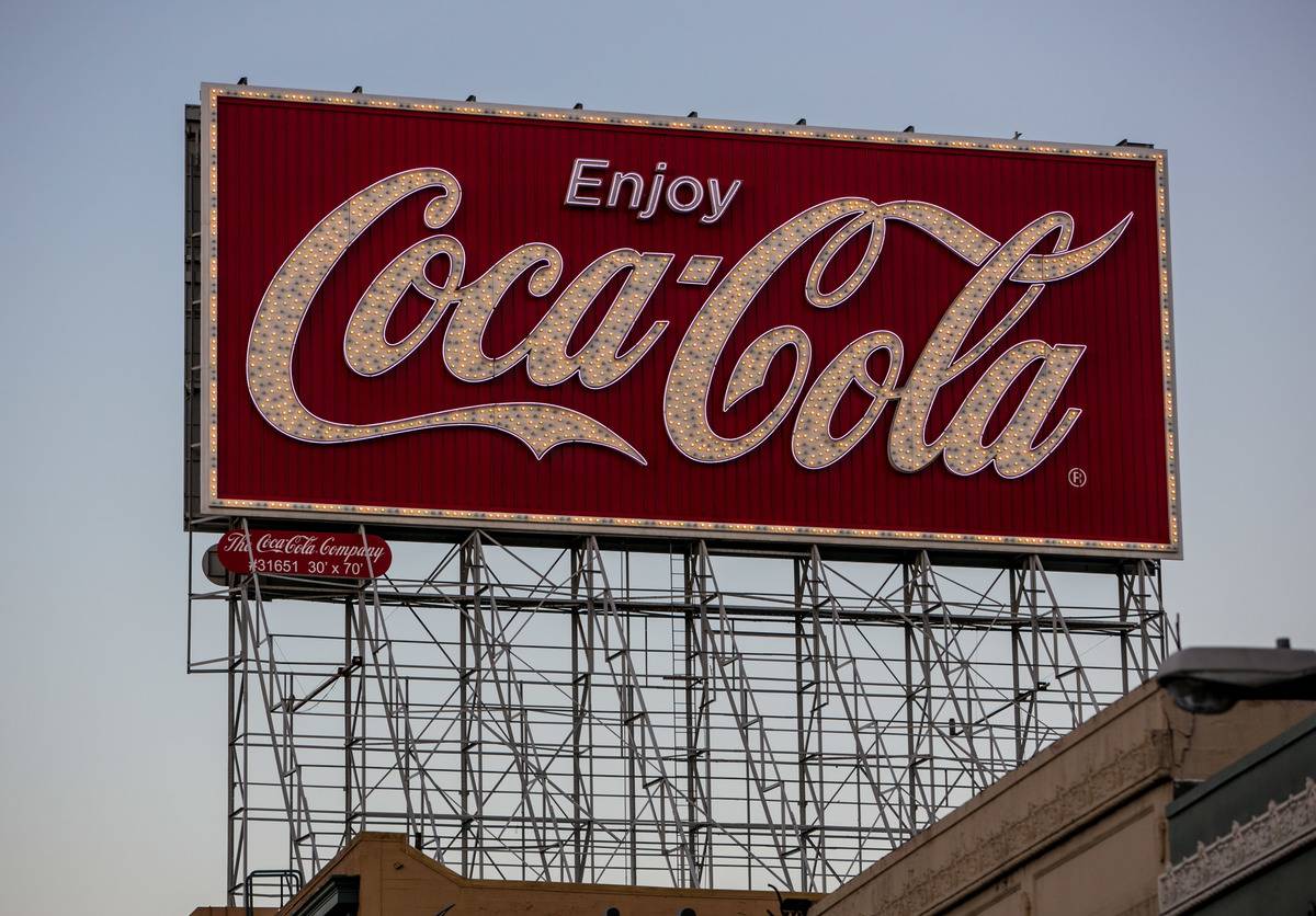 A large Coca-Cola billboard