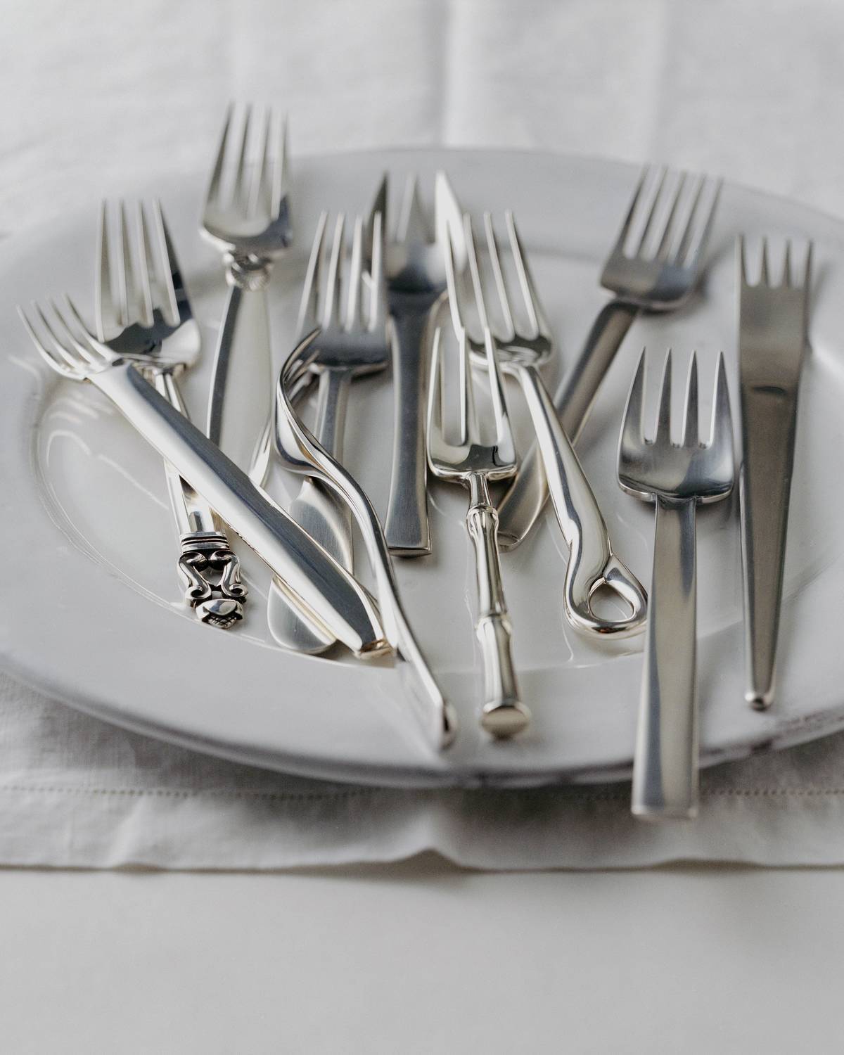 Eleven forks on a plate: