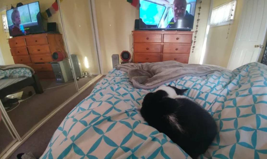 television and mirror reflection of television show two different images