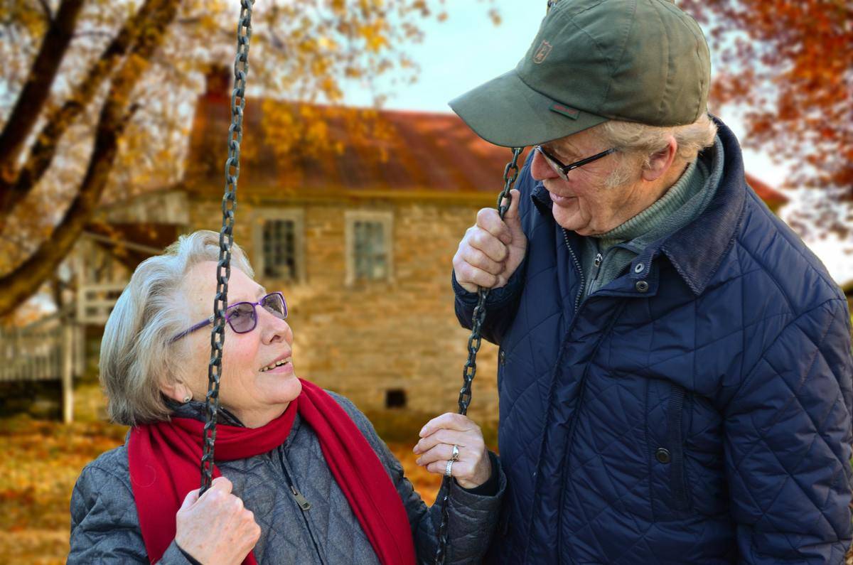 older couple woman on swing