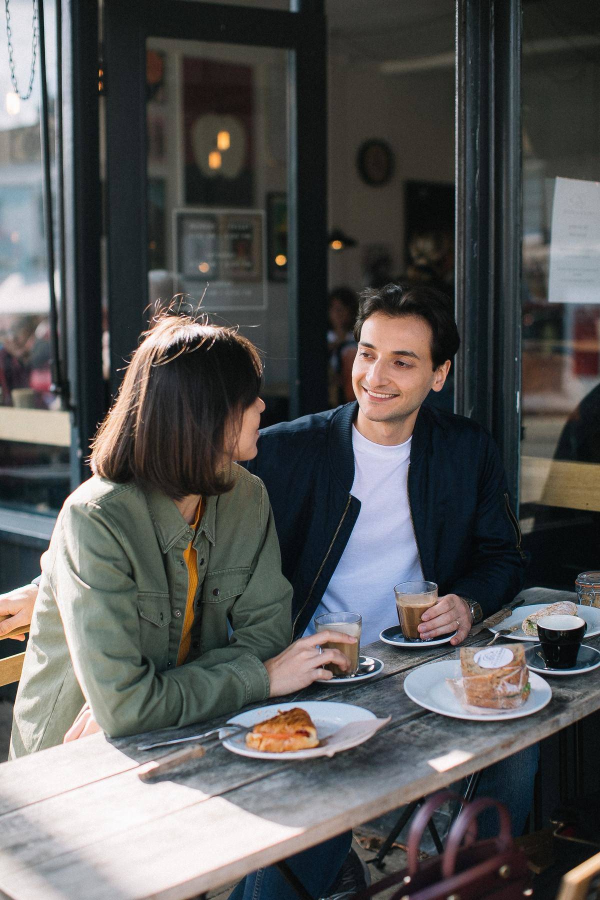 man-and-woman-having-breakfast-outside-a-