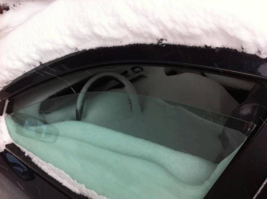 window of car left open during blizzard