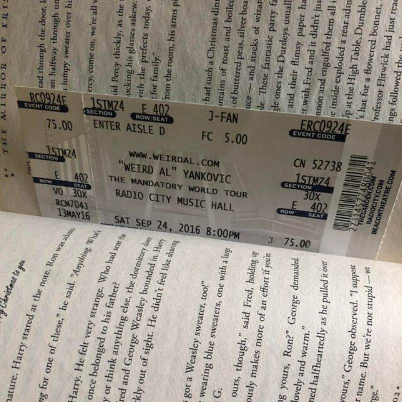a Weird Al ticket in a book