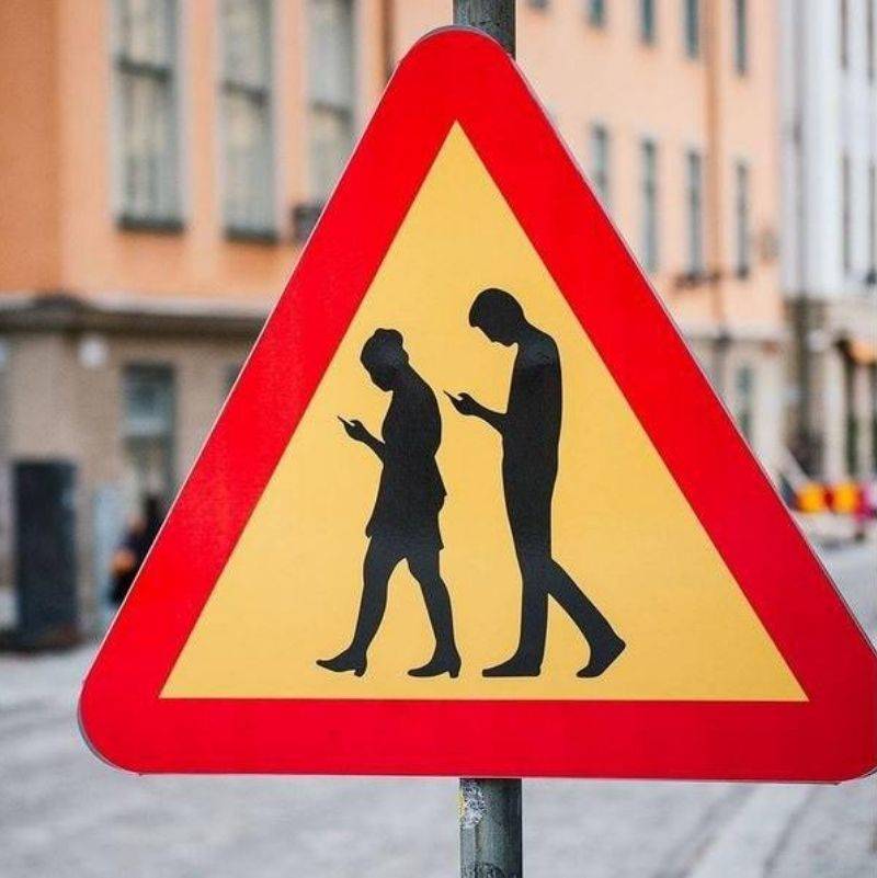 a sign alerting you to people on their phones