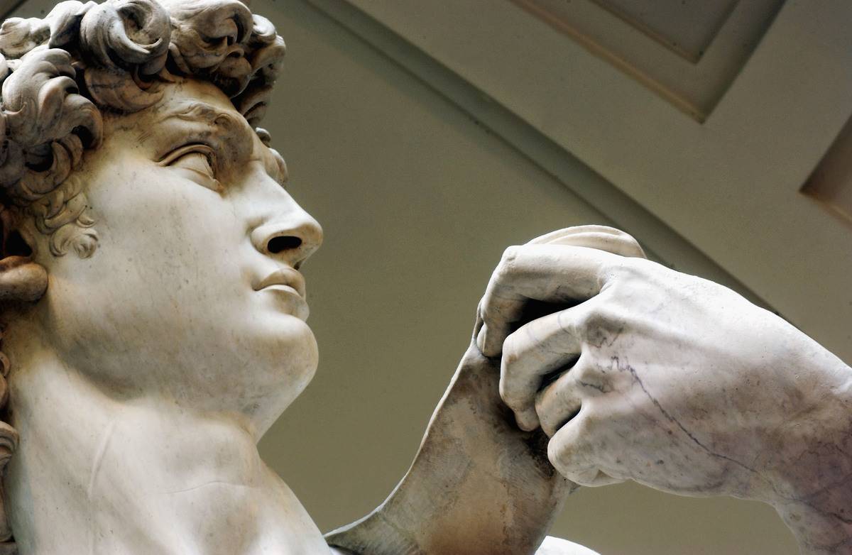 A close-up shows the face of the statue David.
