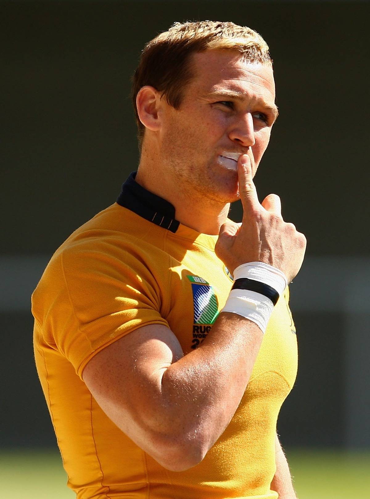 Matt Giteau of the Wallabies applies sunscreen on his lips.