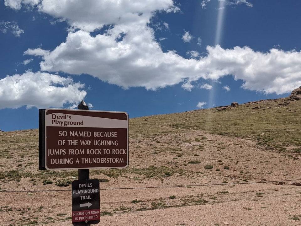 a beware of frequent lightning sign
