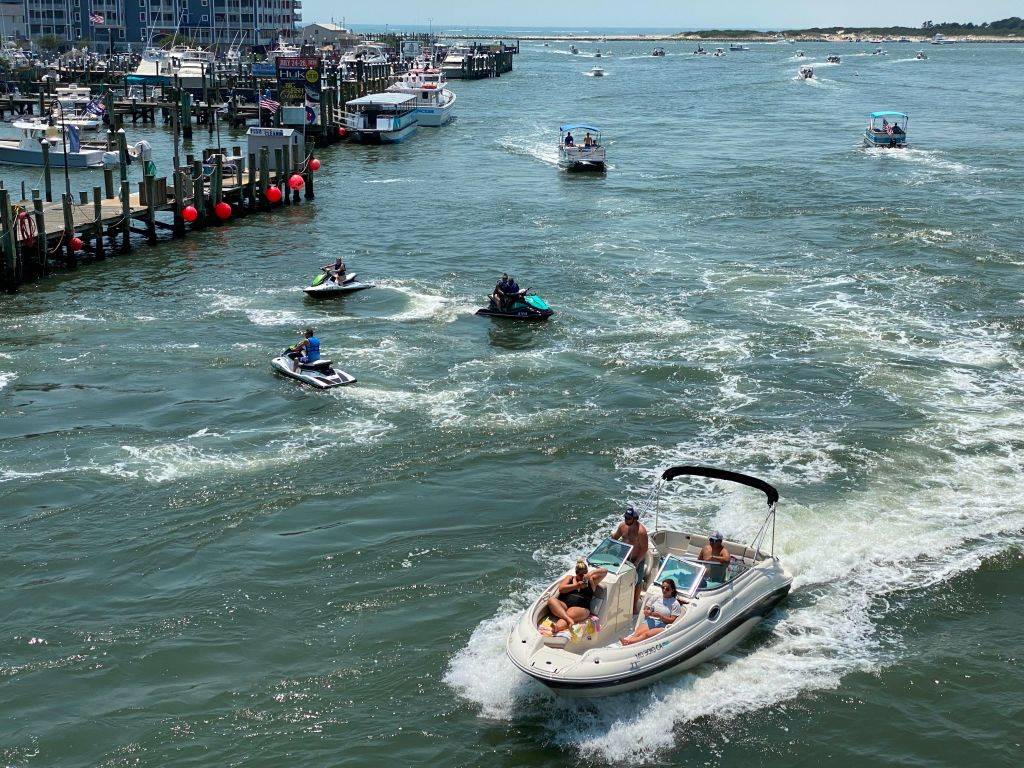 people riding on boats and jet skis in Ocean City, Maryland