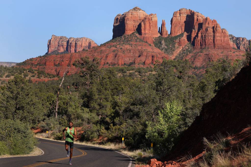 a runner going past the rocks in Sedona, Arizona