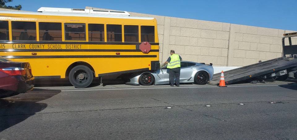 sportscar that got stuck under school bus in accident
