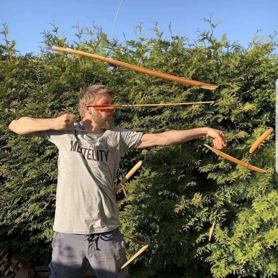 guy breaking a bow and arrow