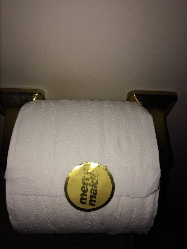 toilet paper with a merry maid sticker on it