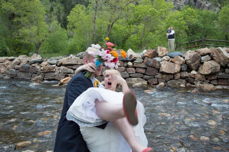 someone dropping his new wife into a stream